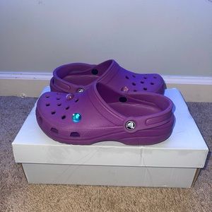 Worn purple crocs